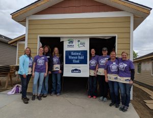 Jody stands with a group of volunteers at Habitat for Humanity
